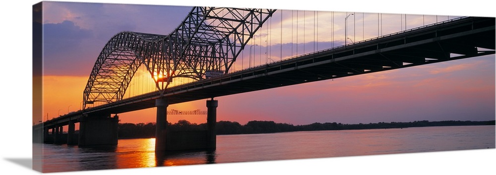 Picture taken of the sunset through a bridge over the Mississippi river.