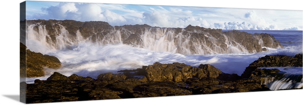 Surf crashing over seastack at Playa Los Cerritos, Cerritos, Baja California Sur, Mexico.