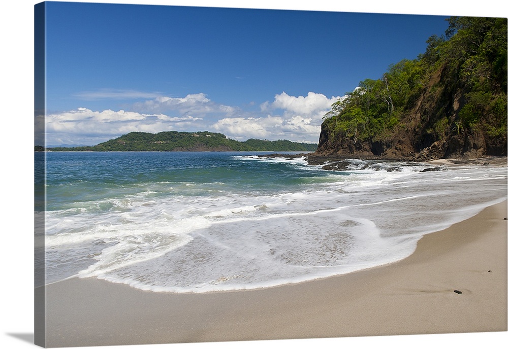 Big photo on canvas of waves washing onto a tropical beach.