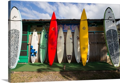 Surfboards leaning against beach shack, Hawaii