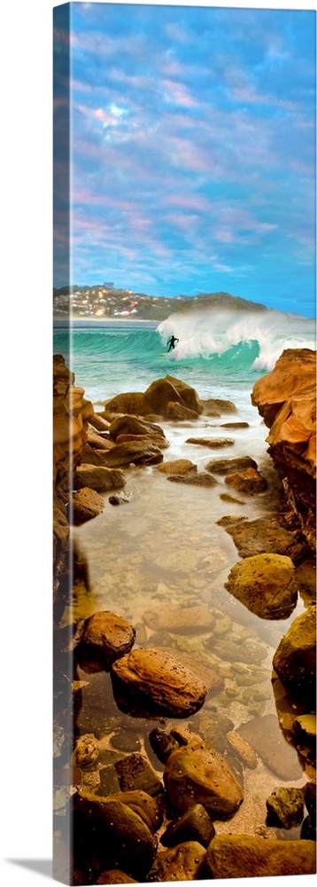 Surfer riding wave in sea, Avoca Beach, New South Wales, Australia.