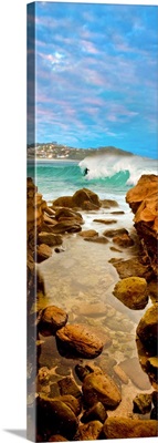 Surfer riding wave in sea, Avoca Beach, New South Wales, Australia