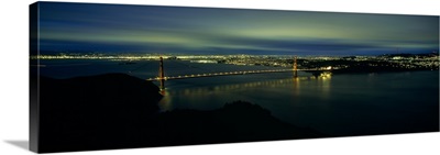 Suspension bridge lit up at dusk, Golden Gate Bridge, San Francisco Bay, San Francisco, California,