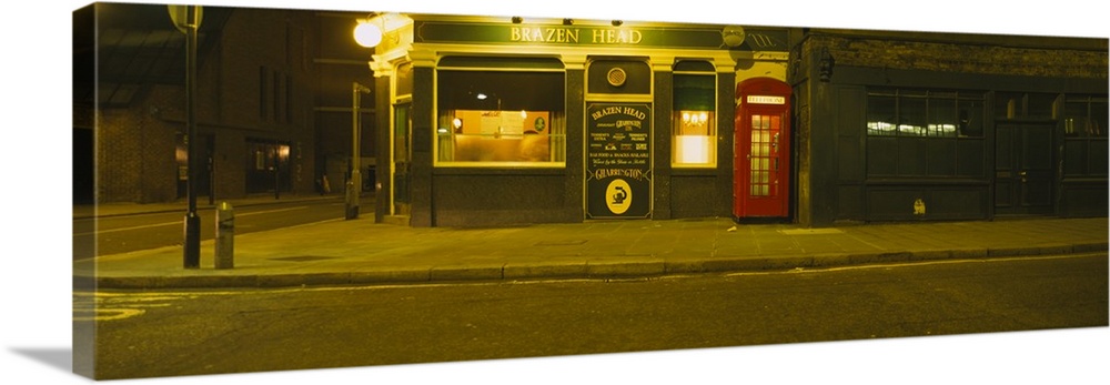 Telephone booth outside a pub, Brazen Head, London, England