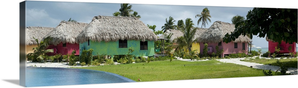 Thatched roof huts on the beach, San Pedro, Ambergris Caye, Belize