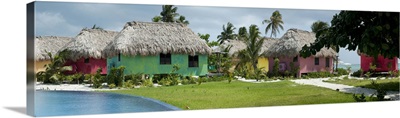 Thatched roof huts on the beach, San Pedro, Ambergris Caye, Belize