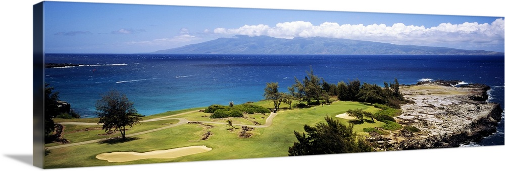 Big horizontal panoramic photograph of a golf course by the ocean in Maui, Hawaii (HI).