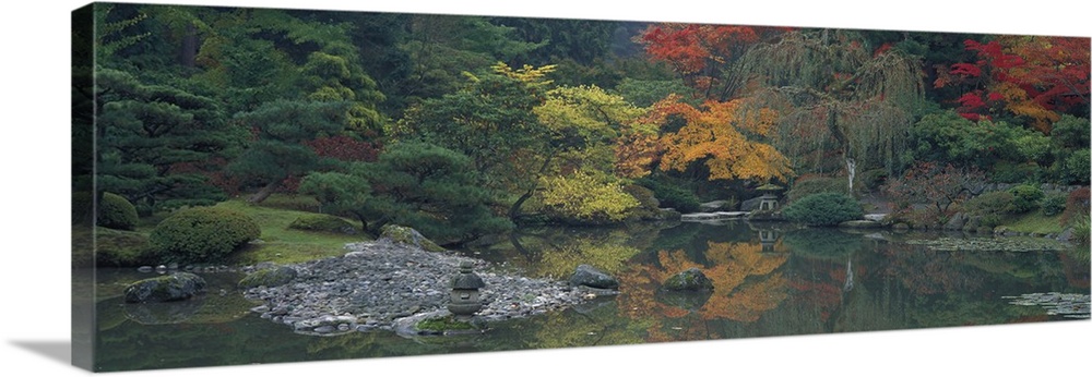 Giant panoramic photo of the Japanese Garden in Seattle, Washington (WA) with trees and stones lining a body of water. Gre...