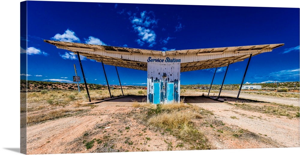 The ruined remains of a gas station near utah colorado border - "service station" - midcentury architecture.