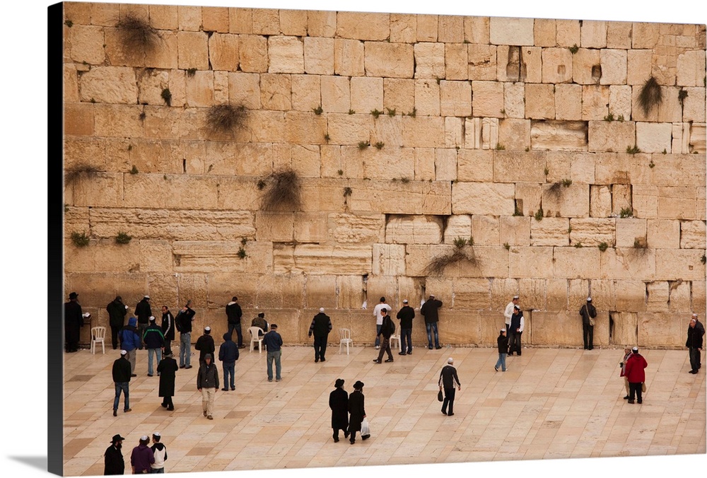 Elevated view of the Western Wall Plaza with people praying at the wailing wall, Jewish Quarter, Old City, Jerusalem, Israel