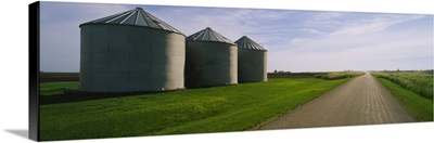 Three silos in a field