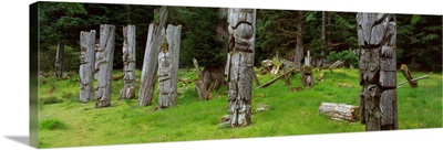 Totem Poles in a forest, SGaang Gwaii, British Columbia, Canada
