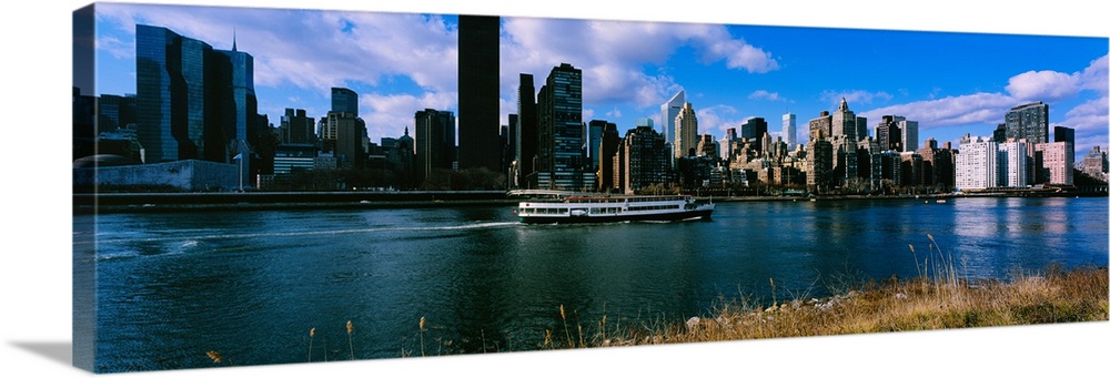 Tourboat moving in river, East River, Manhattan, New York City, New York State, USA
