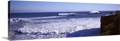 Tourist looking at waves in the sea, Santa Cruz, Santa Cruz County, California,