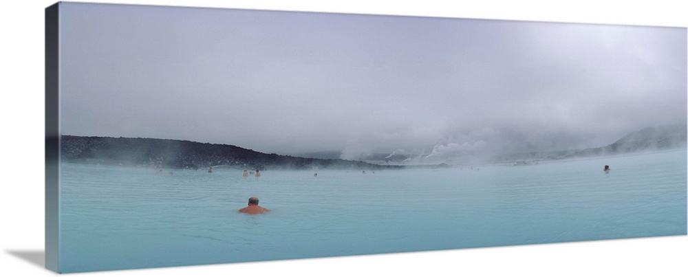 Tourist swimming in a thermal pool, Blue Lagoon, Reykjanes Peninsula, Reykjavik, Iceland