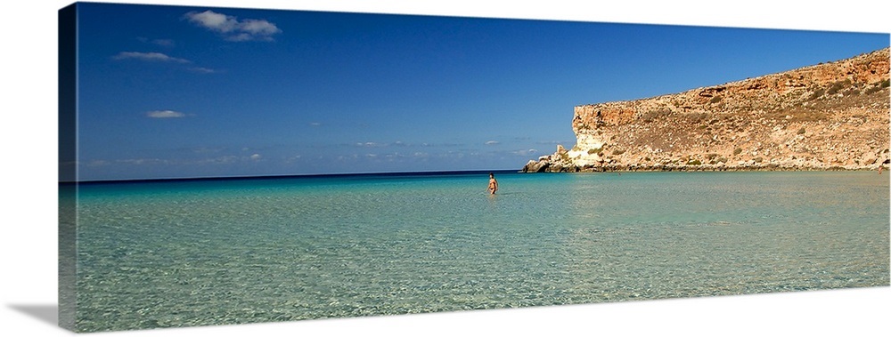 Tourist Walking In The Sea Spiaggia Dei Conigli Italy