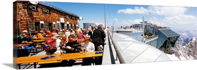 Tourists at restaurant on top of a mountain, Zugspitze Mountain, Bavaria, Germany