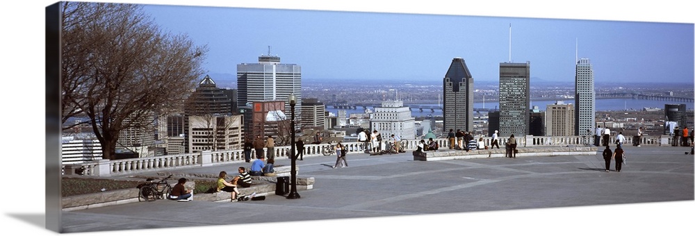 Tourists on a mountain lookout with a city in the background, Kondiaronk Belvedere, Montreal, Quebec, Canada