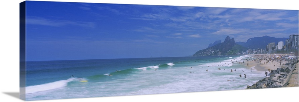 Panoramic photo on canvas of a crowded beach in Brazil with waves crashing ashore.