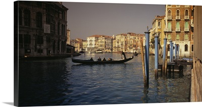 Tourists sitting in a gondola, Grand Canal, Venice, Italy