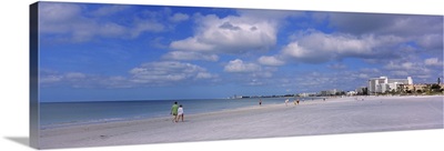 Tourists walking on the beach, Crescent Beach, Gulf Of Mexico, Siesta Key, Florida