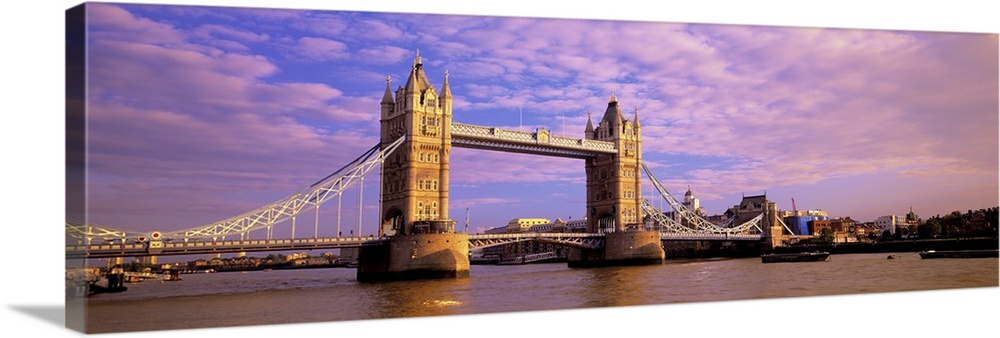 Daytime panorama of London's Tower Bridge, which crosses the River Thames.