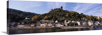 Town at the riverside with Reichsburg Castle on hill, Rhineland-Palatinate, Germany