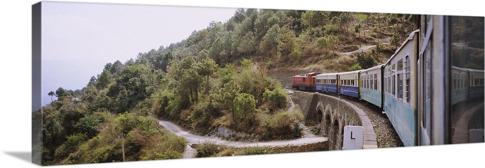 Toy train passing over a bridge, Himachal Pradesh, India
