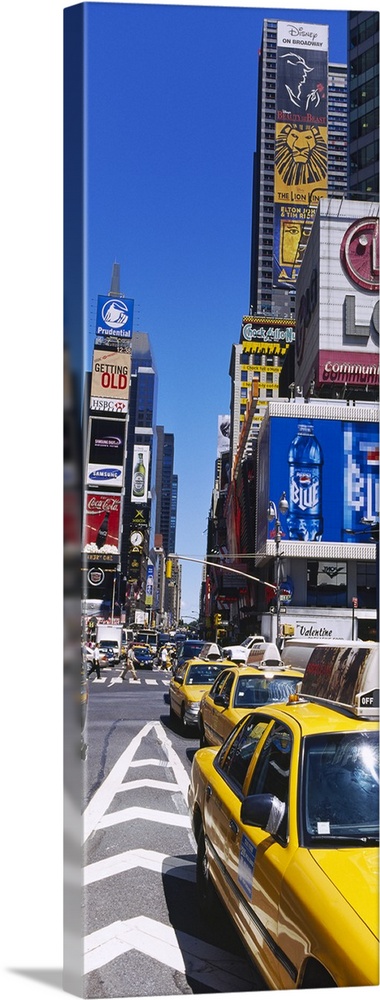 Vertical panoramic photograph taken of a busy street in Times Square.