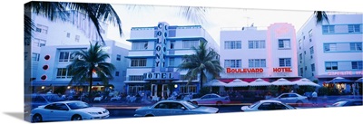 Traffic on road in front of hotels, Ocean Drive, Miami, Florida