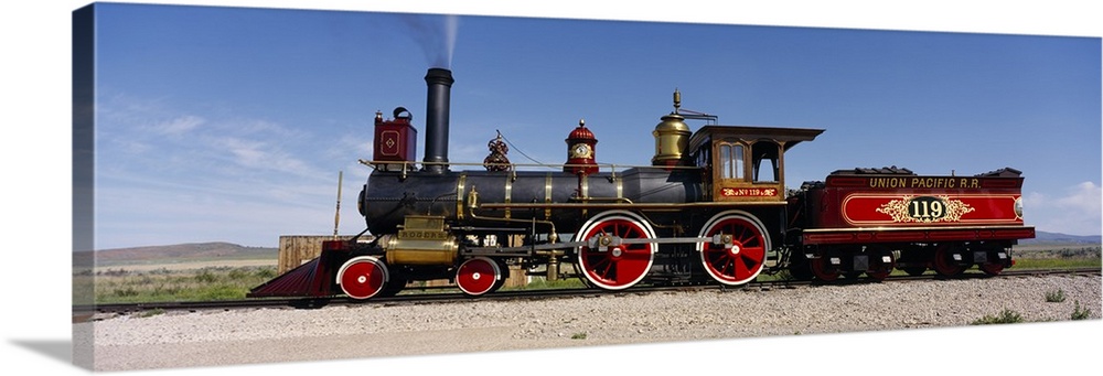 Panoramic photograph of vintage train car on railway.