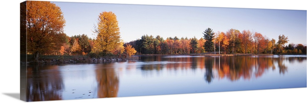 Trees in autumn along a lake, Canterbury, New Hampshire, England Wall ...