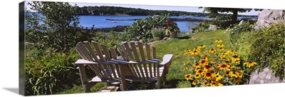 Two adirondack chairs in a garden, Peaks Island, Casco Bay, Maine