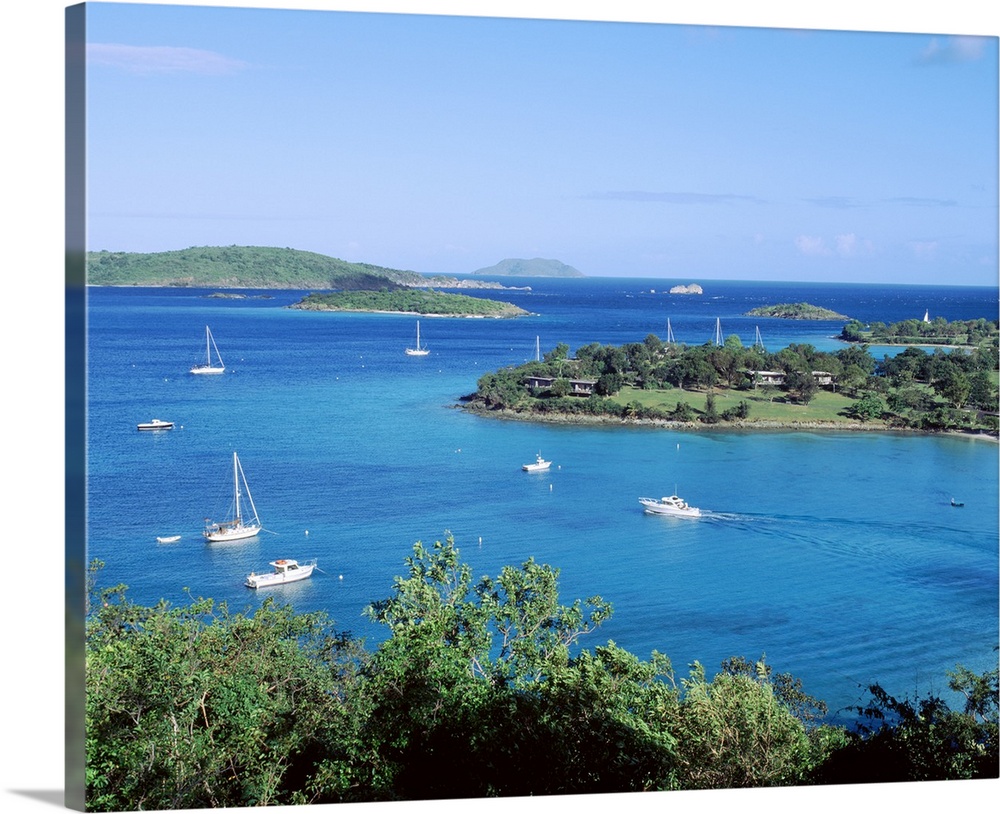 Large photo on canvas of sail boats in a bay in the ocean.