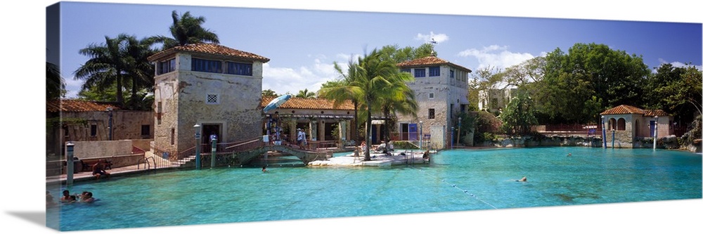The large public Venetian pool in Florida is photographed in panoramic view.