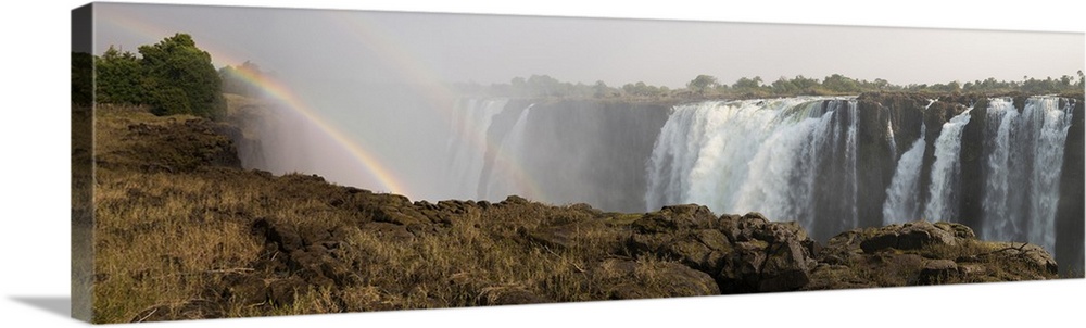 Victoria Falls with rainbow in the mist, Zambezi River, Zimbabwe.
