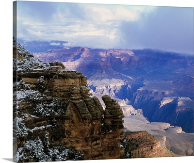 View of snow and storm clouds over Grand Canyon from Mather Point, south rim, Grand Canyon National Park, Arizona