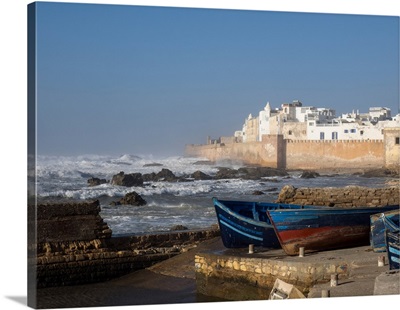 View of wall around medina with waves crashing against wall, Essaouira, Morocco