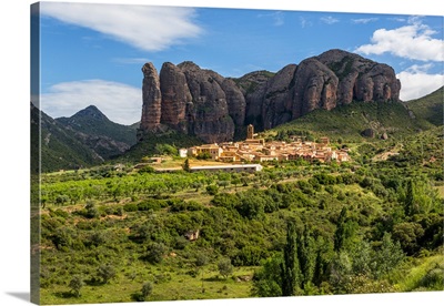 Village of Aguero beneath the conglomerate rock formations, Aragon, Spain