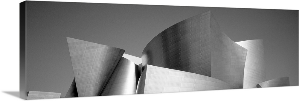 Panoramic monochromatic photograph shows the outside of a large musical theater found within the nicknamed "City of Angels...