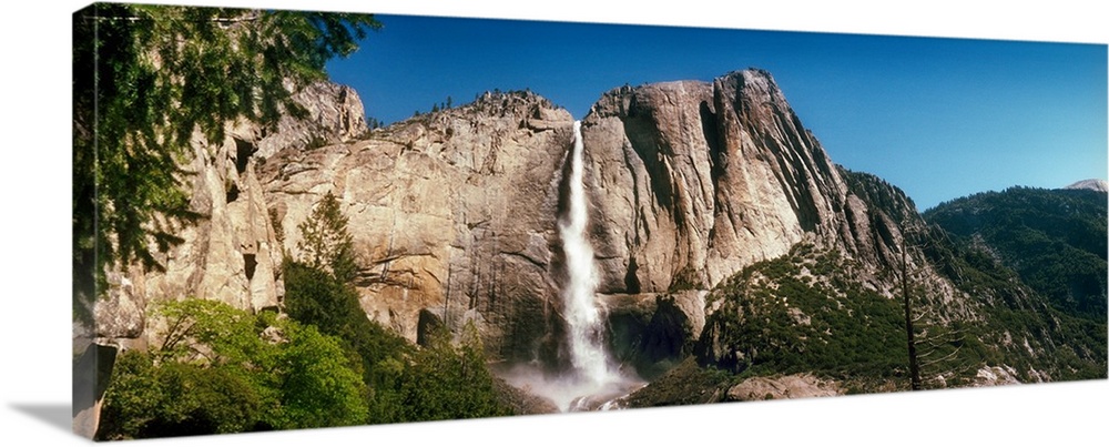 Water falling from rocks in a forest, Bridalveil Fall, Yosemite Valley, Yosemite National Park, California, USA.