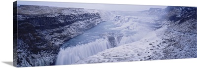 Water flowing through snow covered mountains, Gullfoss Falls, Vesturland, Iceland
