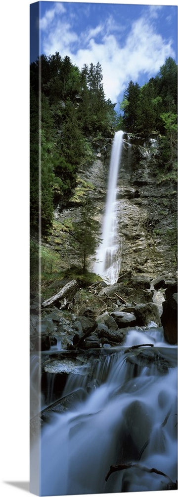 Waterfall in a forest Tatschbachfall Engelberg Obwalden Canton Switzerland