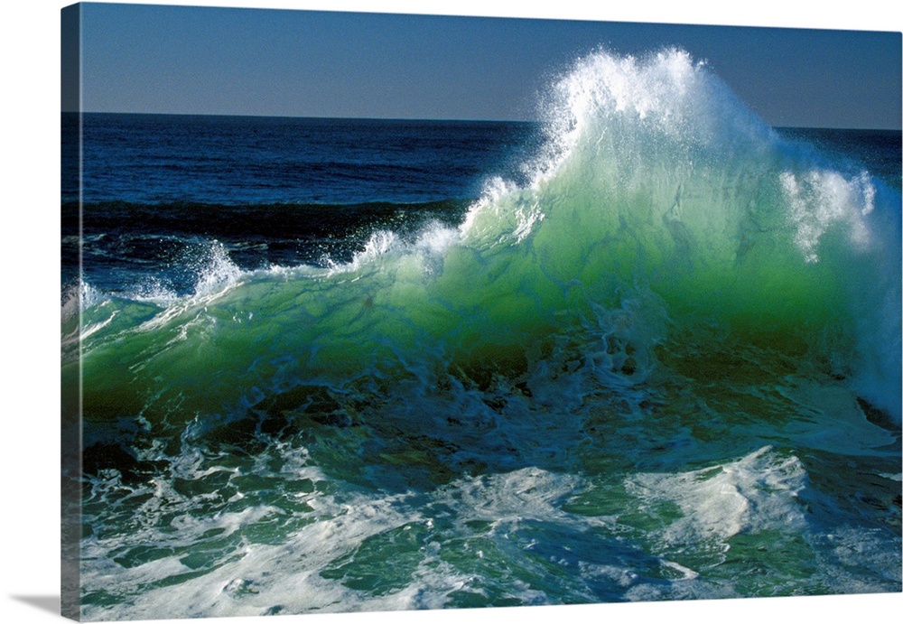 This wall art for the office or home is a landscape photograph of a wave breaking near the shore.