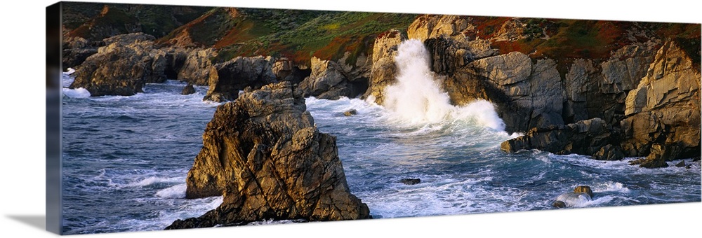 Horizontal photo print of waves crashing into rocky cliffs in the Pacific Ocean and rock formations sticking up out of the...