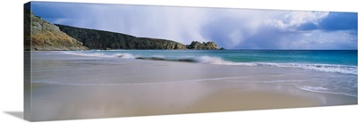 Waves breaking on the beach Logan Rock Porthcurno Bay Cornwall England