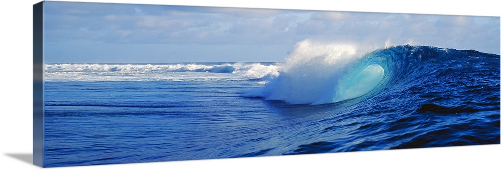 Big canvas art of huge waves crashing in the ocean with no beach in sight.