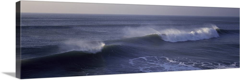 Long horizontal photo on canvas of waves crashing in the Pacific Ocean.