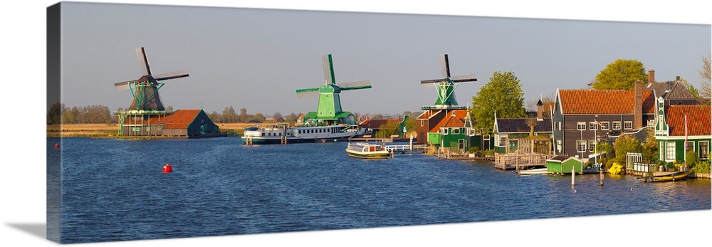 Windmills along the Zaan River at Zaanse Schans, Zaandam, North Holland, Netherlands