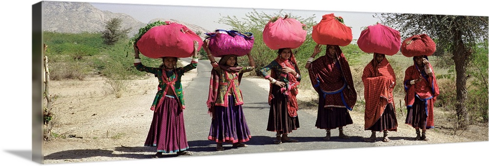 Women standing on a road with luggage on their head, Siana, Jodhpur, Rajasthan, India